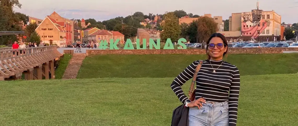Maria Rosa Rojas Noguera, student from Venezuela, standing next to the Kaunas Castle.